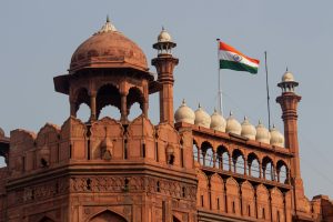 Capture of the iconic Red Fort in Delhi showcasing Mughal architecture and the Indian flag.